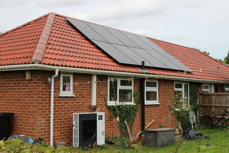 Operational Carbon - home with solar panels and a heat pump uk.